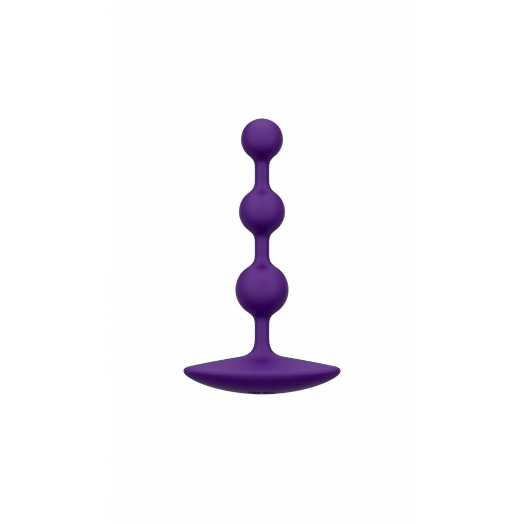 Purple silicone butt plug on a white background
