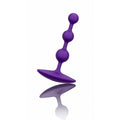 Purple silicone butt plug on a white background