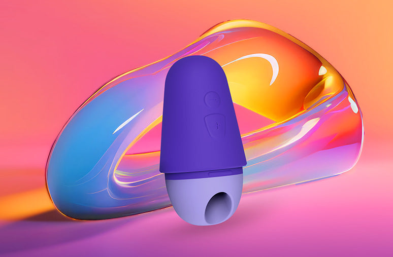 Purple and blue erotic device on a colorful abstract background