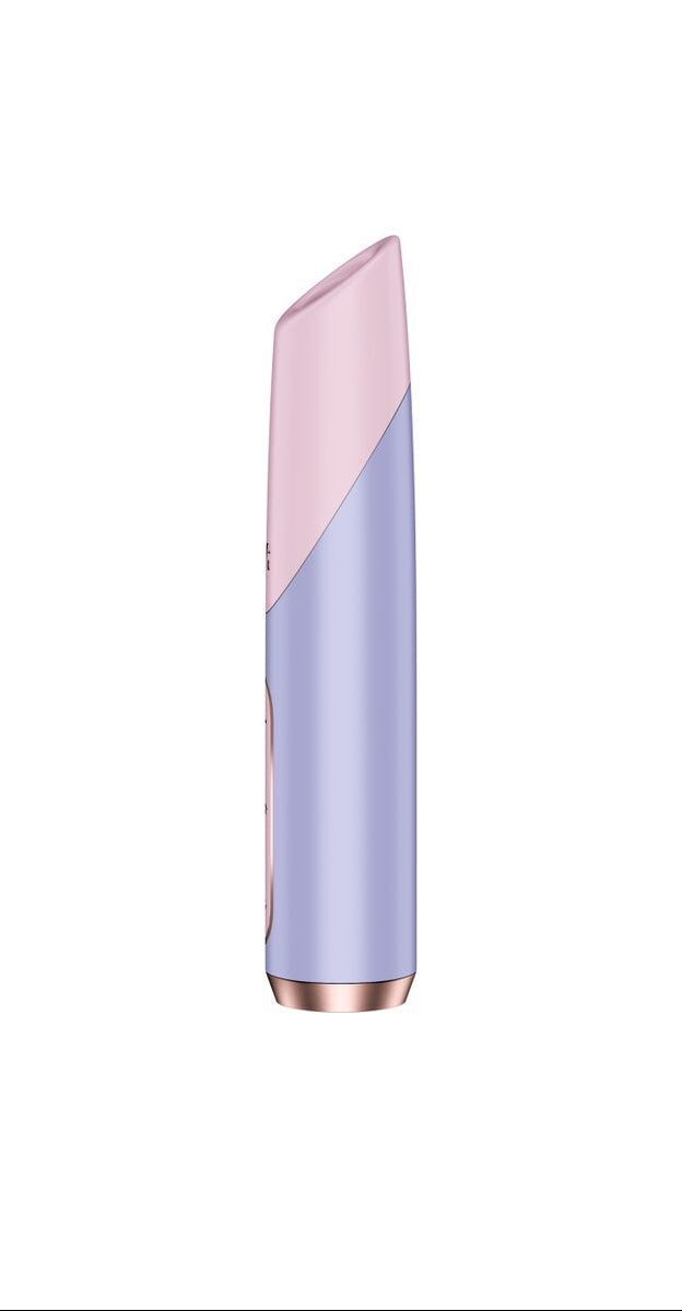 Two-tone lipstick with pink top and purple bottom on a white background