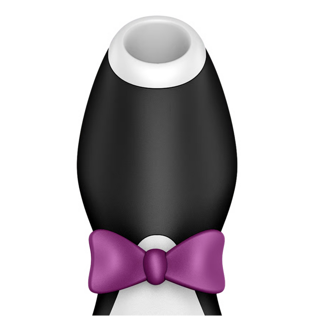 Black and white satisfyer pro penguin  clitoral stimulator with replaceable head cap and purple bow tie on a white background