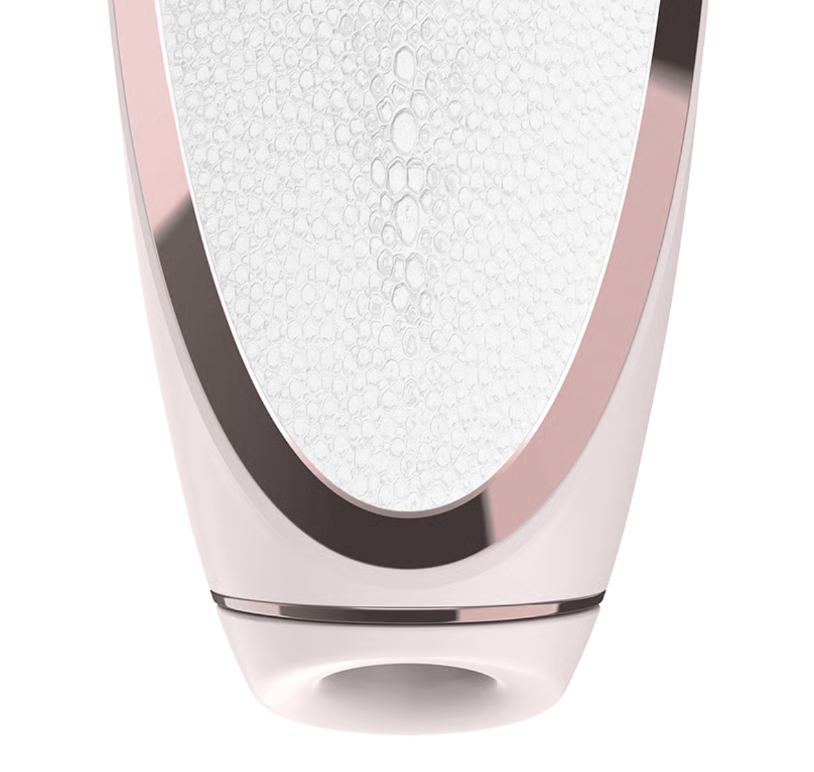 Close-up of a luxury skincare device with a white surface and rose gold accents.