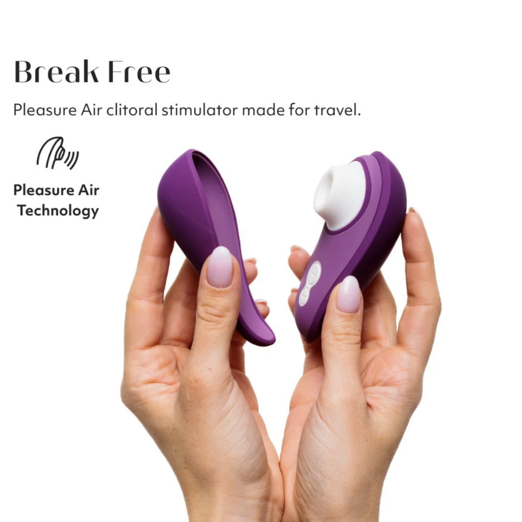 Purple clitoral stimulator held between two hands with 'Break Free' branding on a white background.