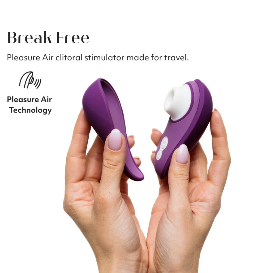 Purple clitoral stimulator held between two hands with 'Break Free' branding on a white background.