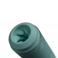 Teal silicone sleeve on a cylindrical masturbator for men with a white background