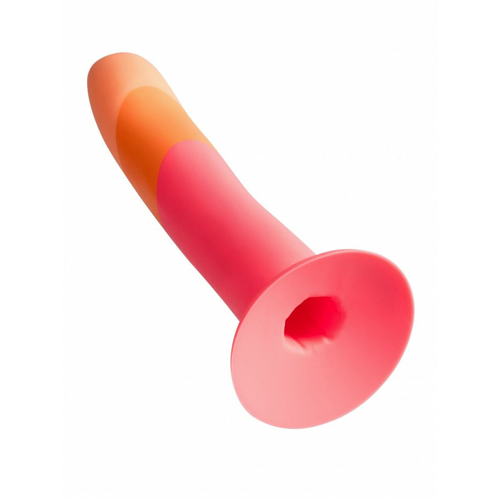 Red and orange silicone dildo on a white background