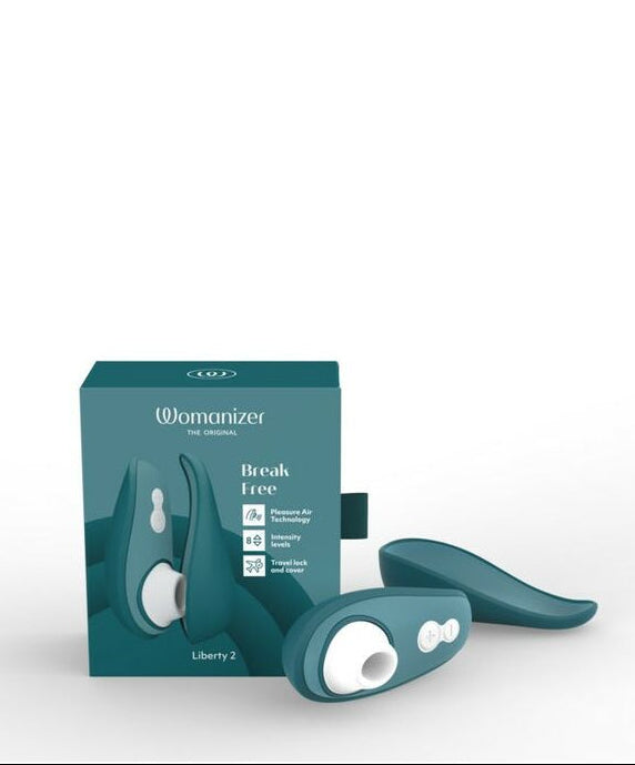 Womanizer Liberty 2 air suction stimulator and teal packaging on a white background