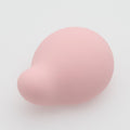 Pink heart-shaped vibrator for women on a light gray background