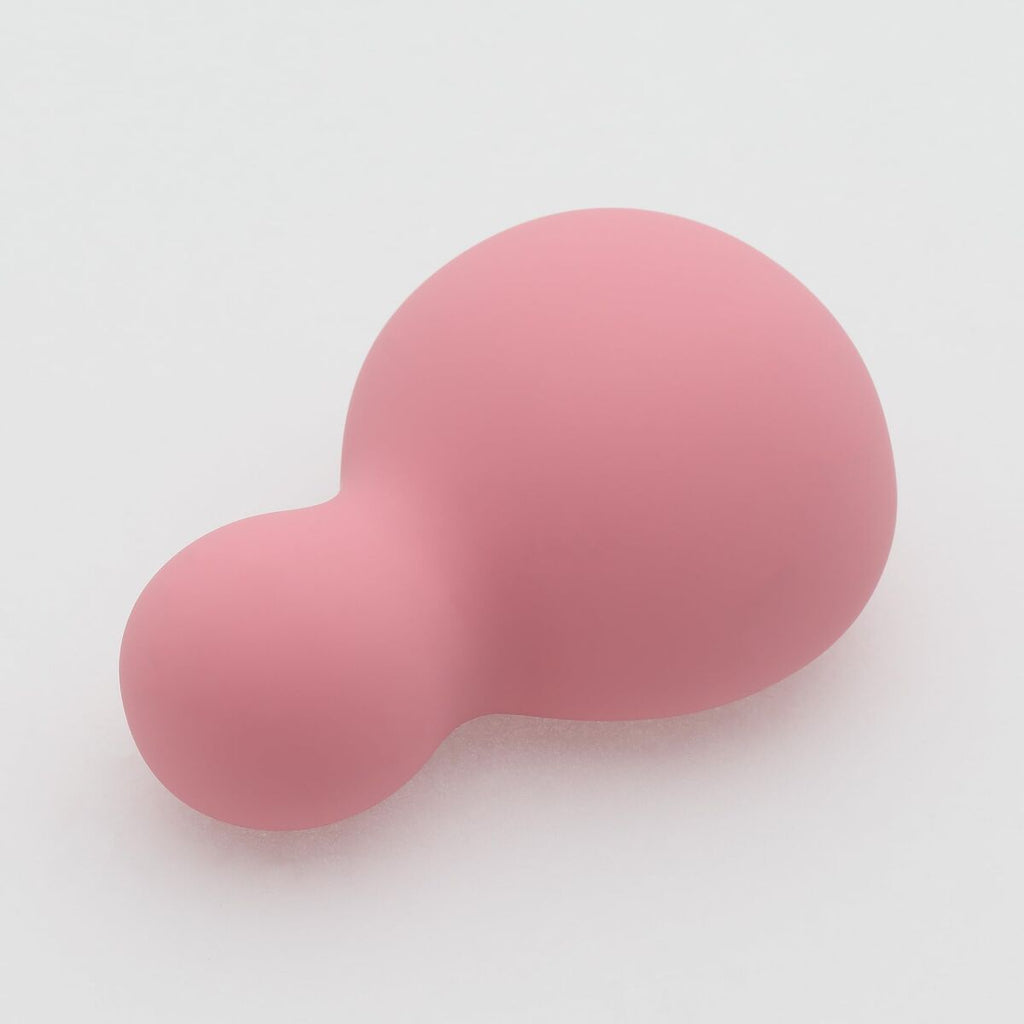 Pink silicone soft vibrator for women on a white background