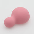 Pink silicone soft vibrator for women on a white background