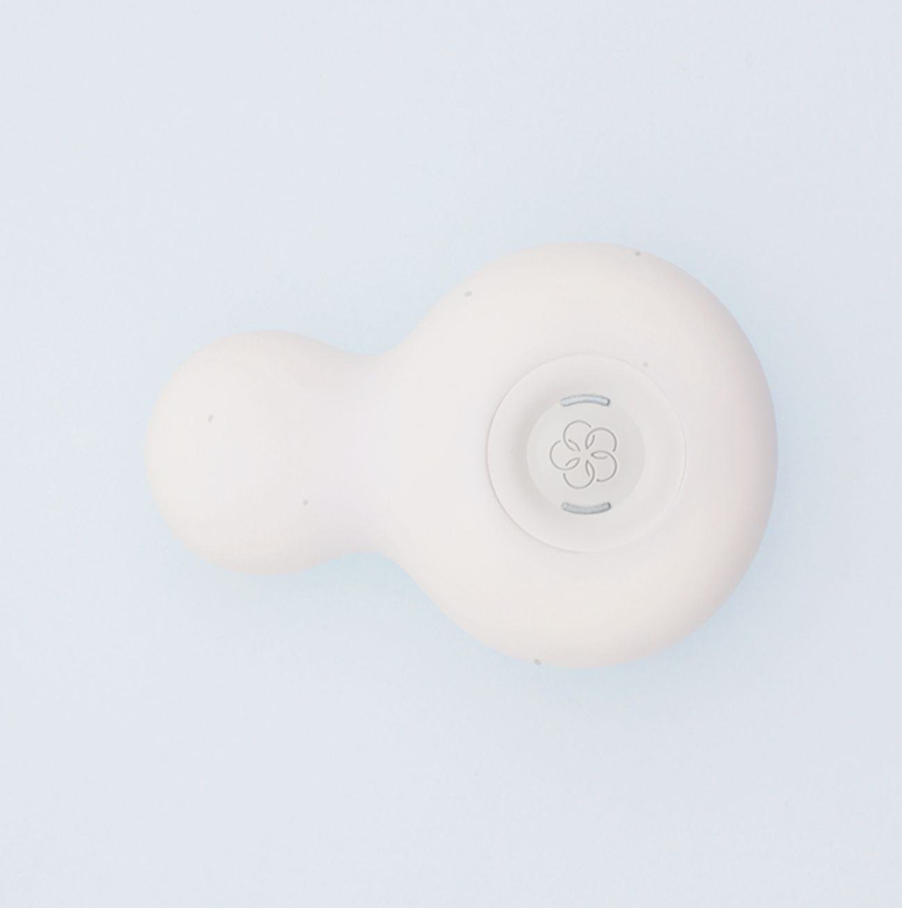 White fitness tracker on a light blue background