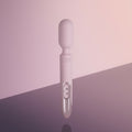 White intimate massager on a gradient pink and purple background