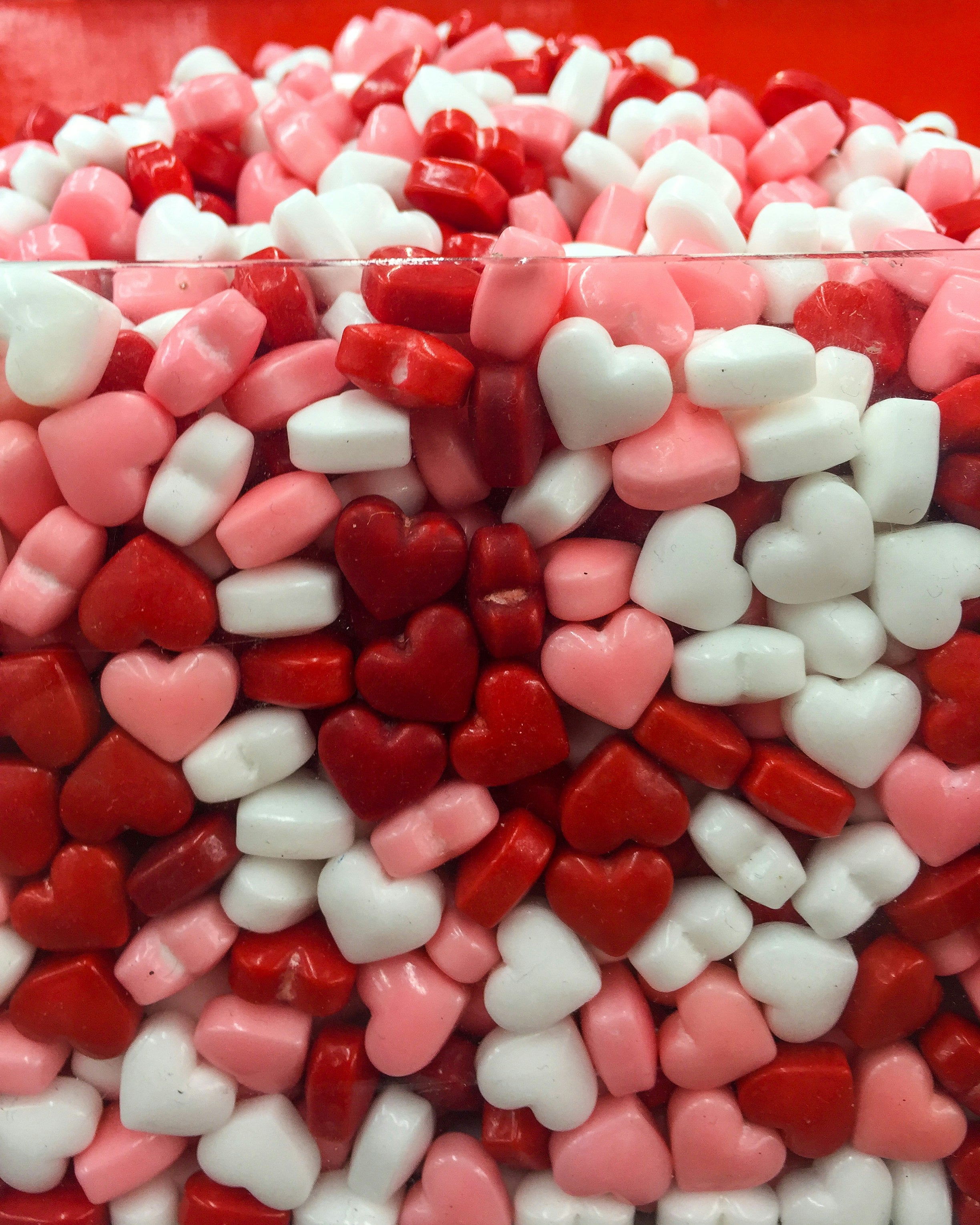 heart shaped candies available in our store with discreet adult toys for women, including vibrators and sensual accessories