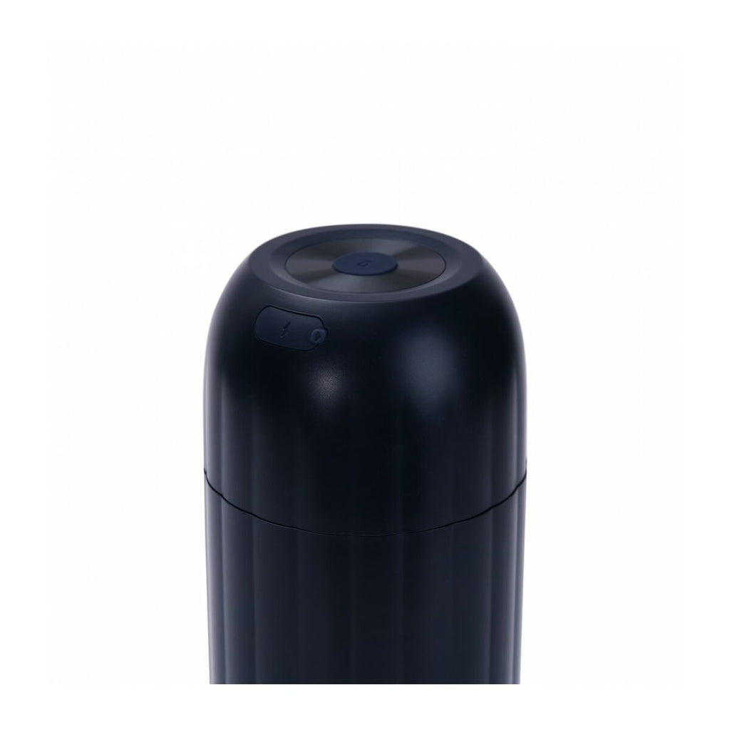 Black cylindrical object on a white background