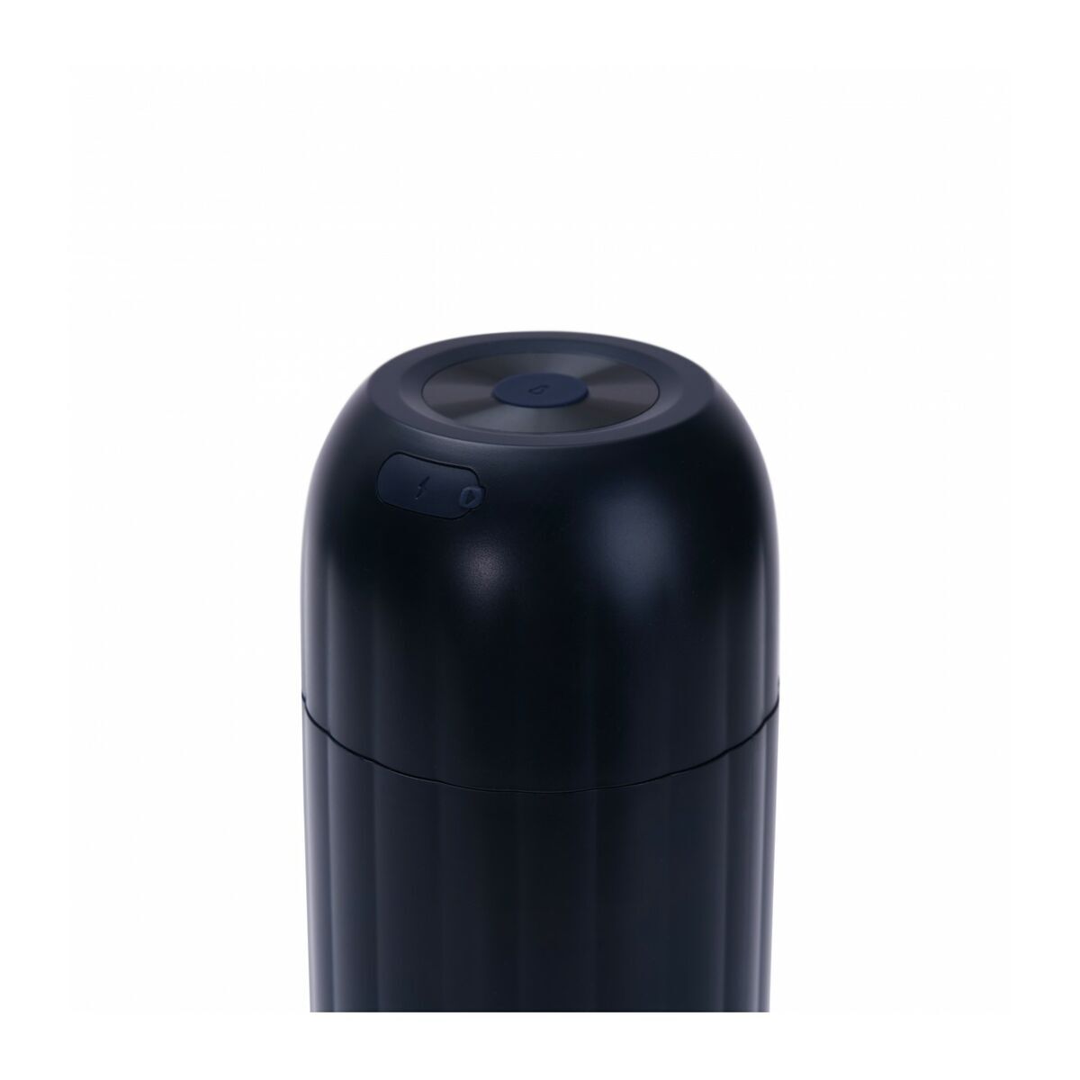 Black cylindrical object on a white background