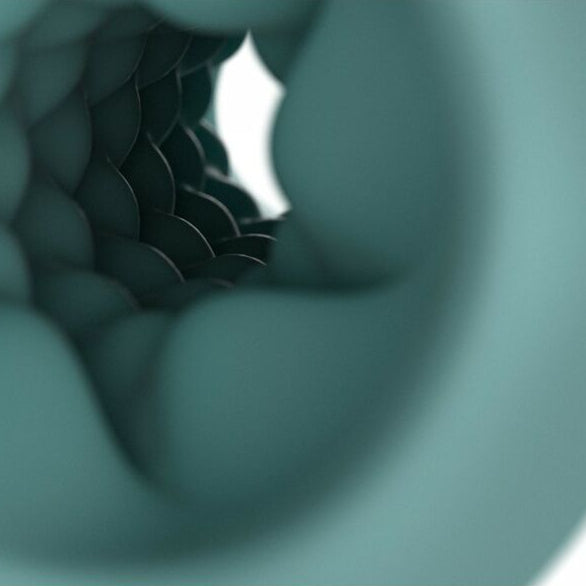 Close-up of a textured green stroker sleeve sex toy with a white background