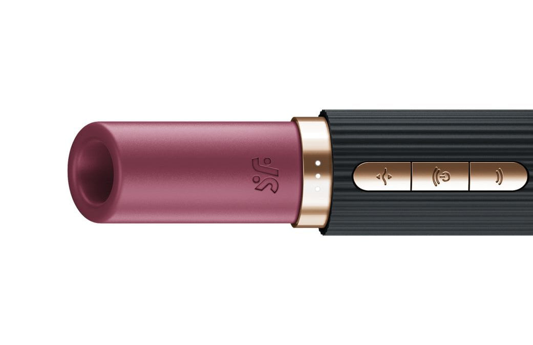 Lipstick vibrator with black and rose gold casing on a white background
