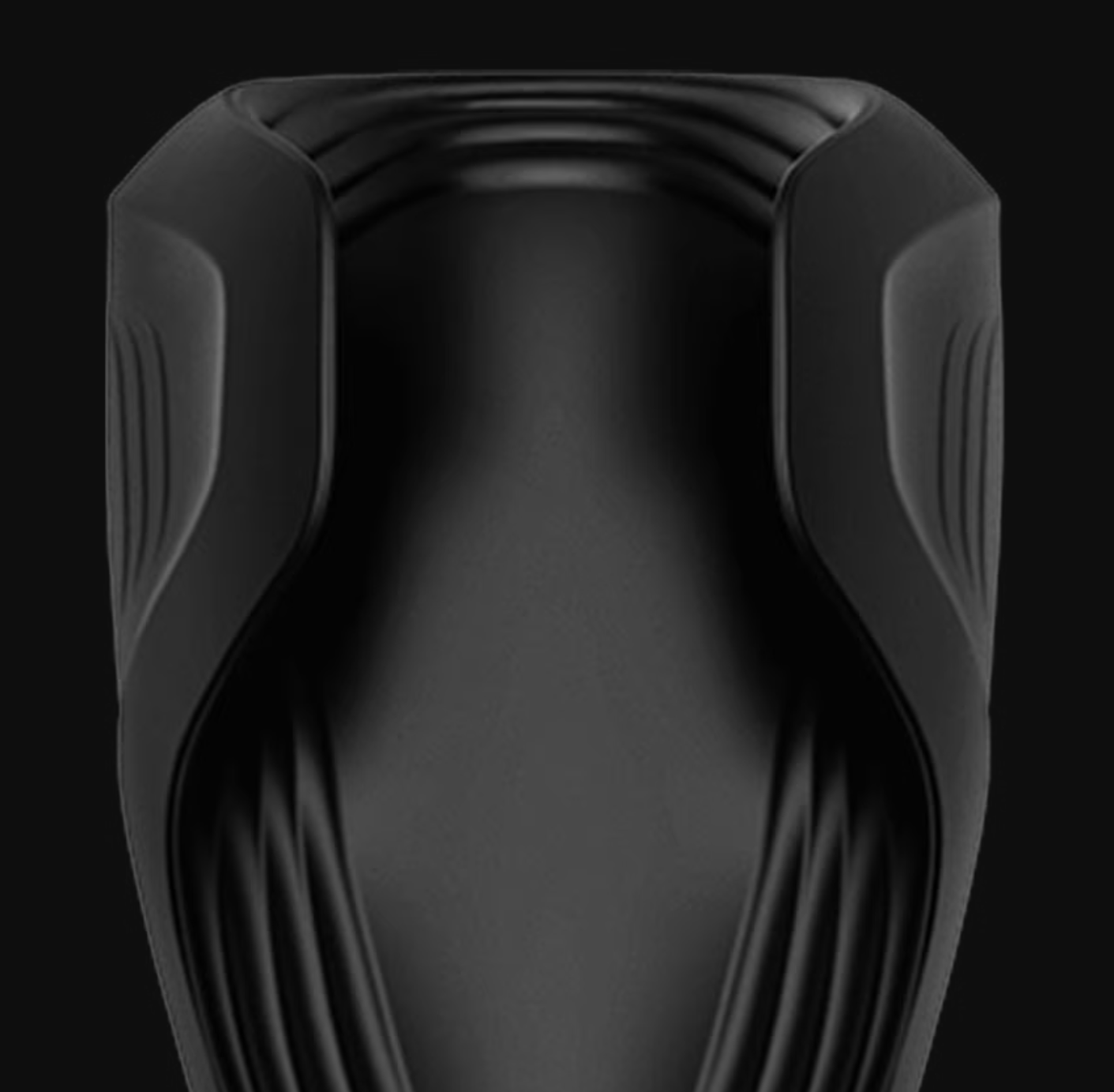 Black, futuristic-looking erotic object on a black background