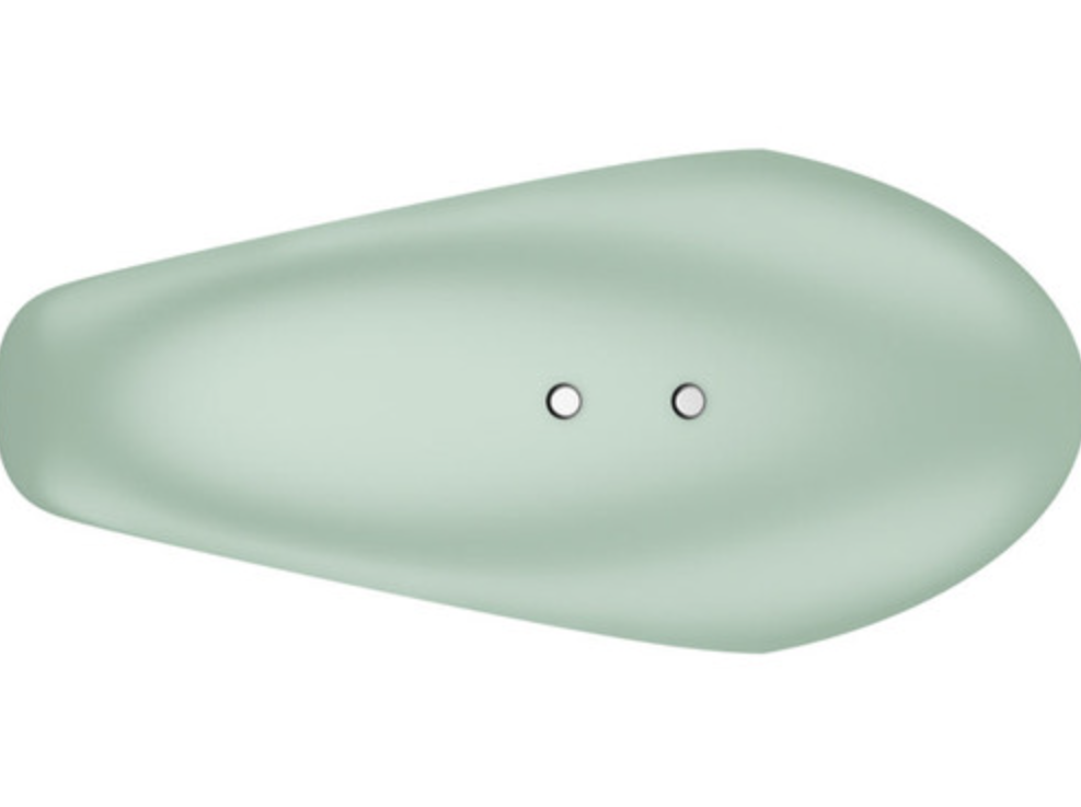 mint green finger vibrator for women with magnetic recharging points over a white background