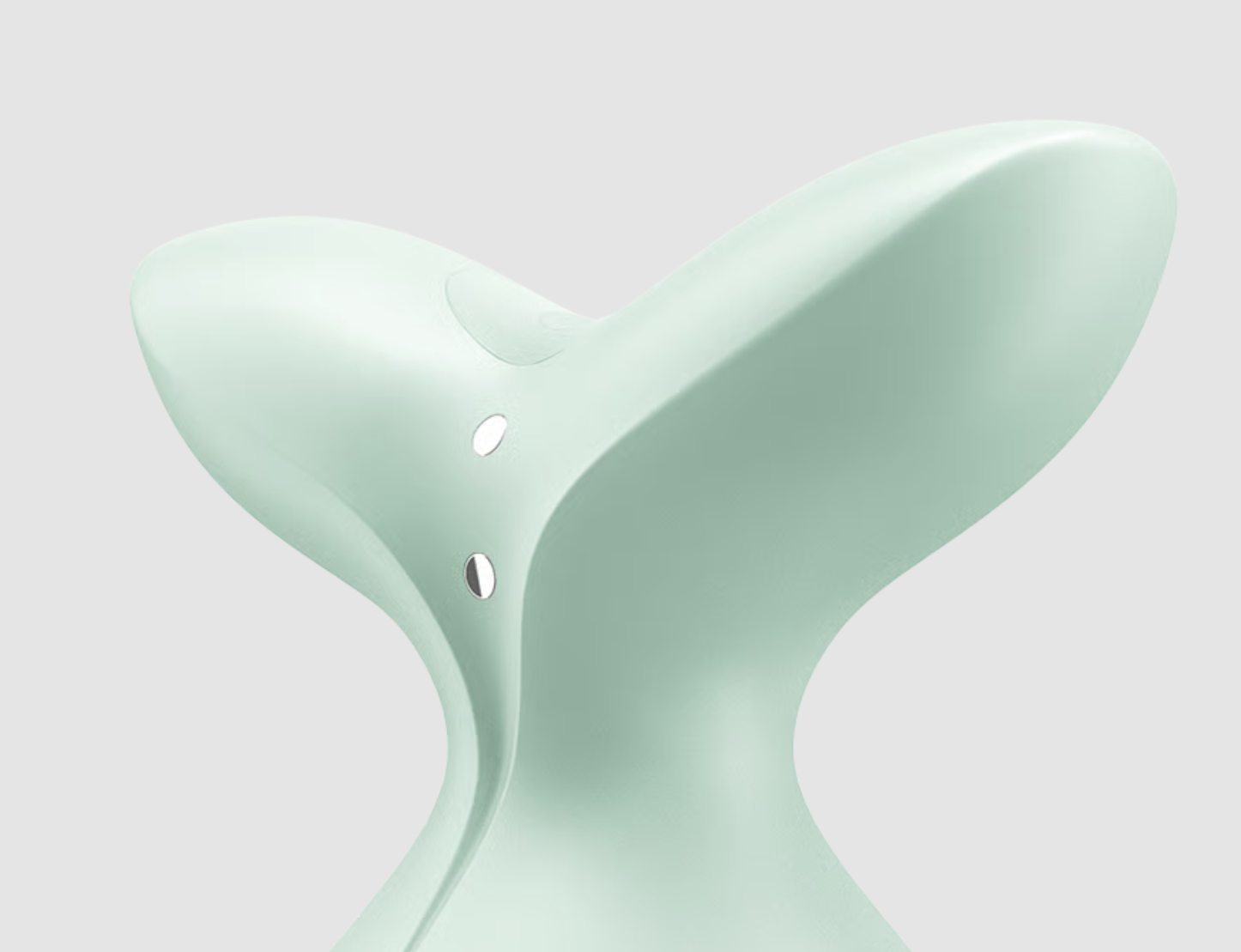 Mint green hourglass-shaped object on a light gray background