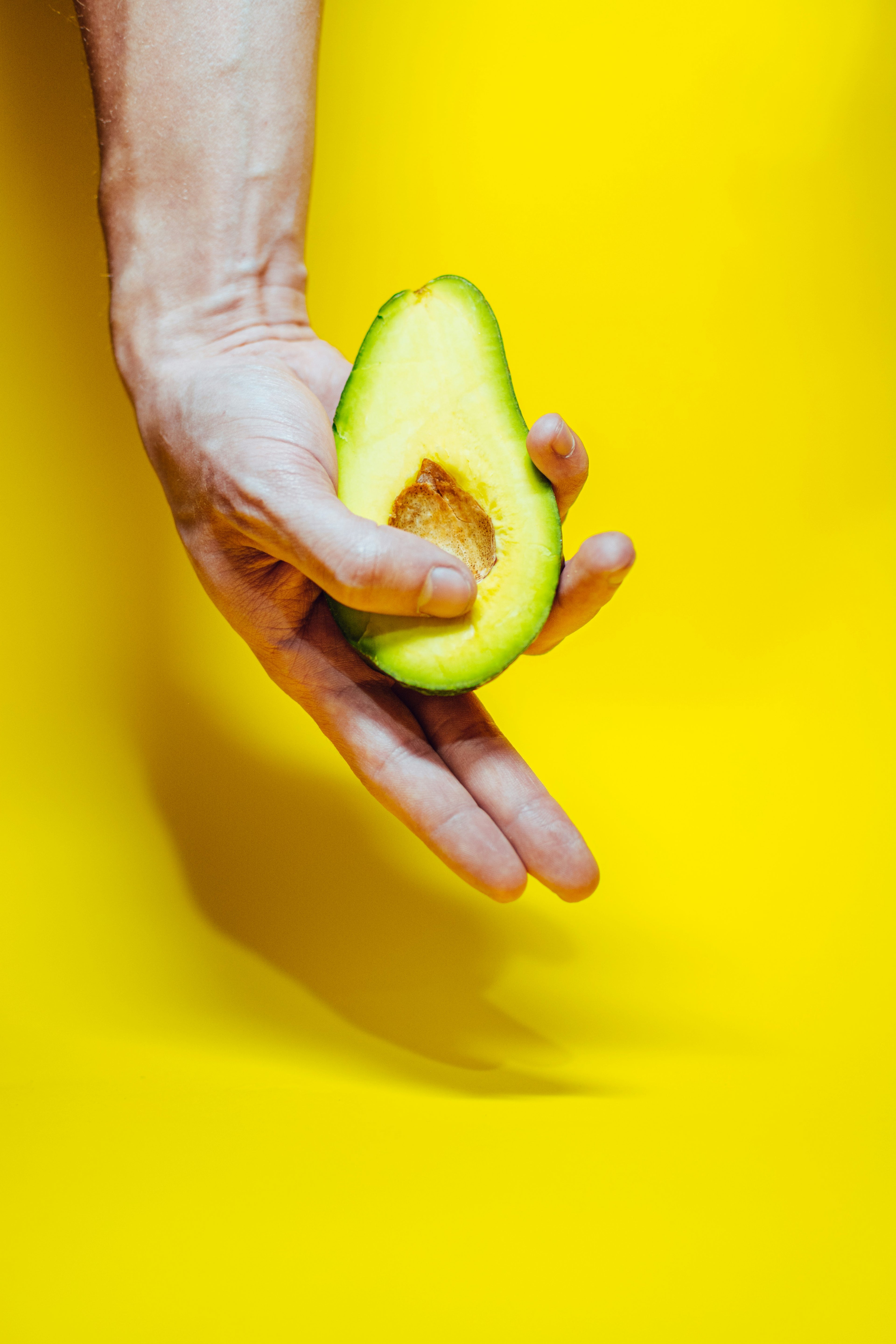 men holding avocado, symbolising Men’s sexual health and supplements designed to support stamina, performance, energy, and confidence