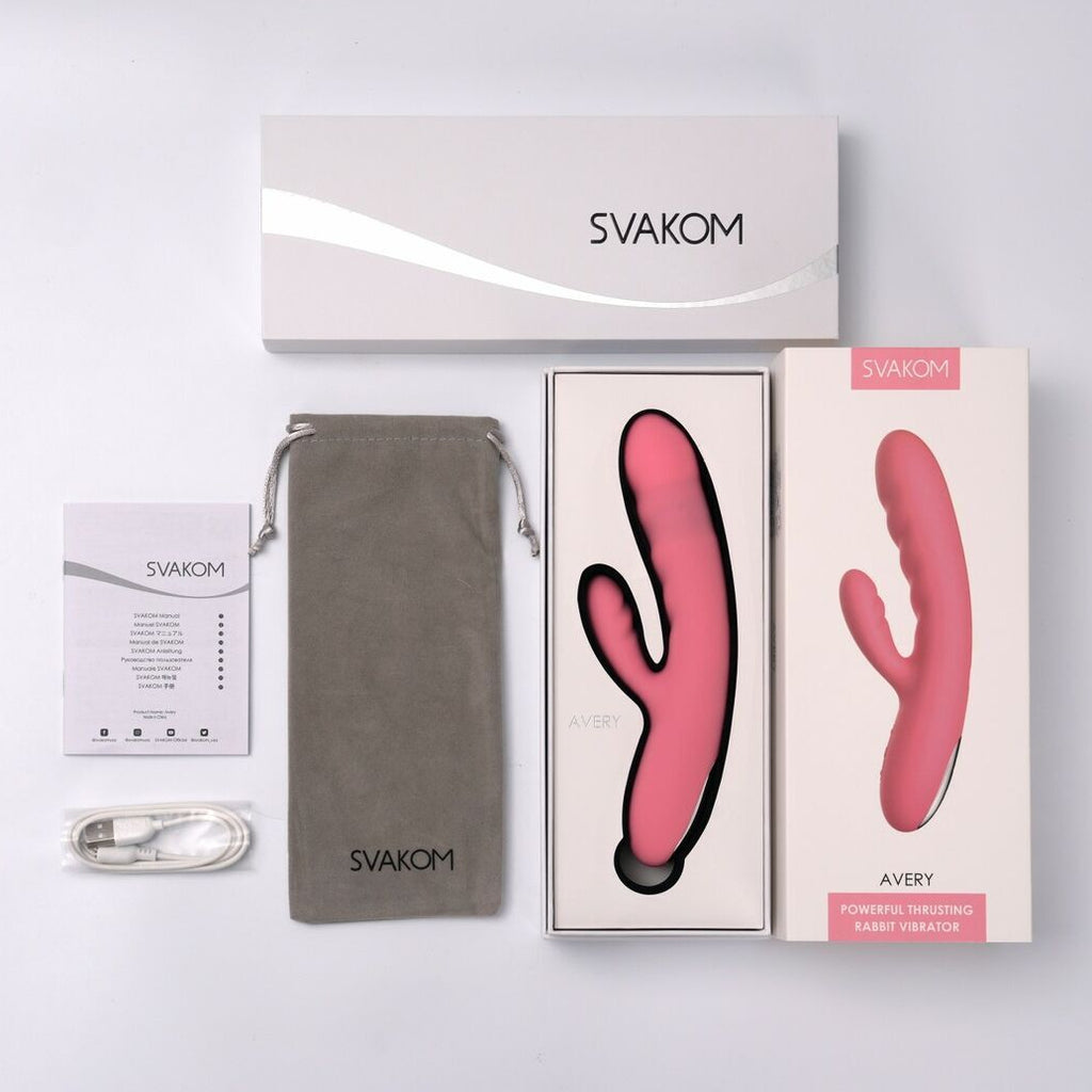 Svakom sexual wellness product set with pink rabbit vibrator device, packaging, and accessories on a light gray background.