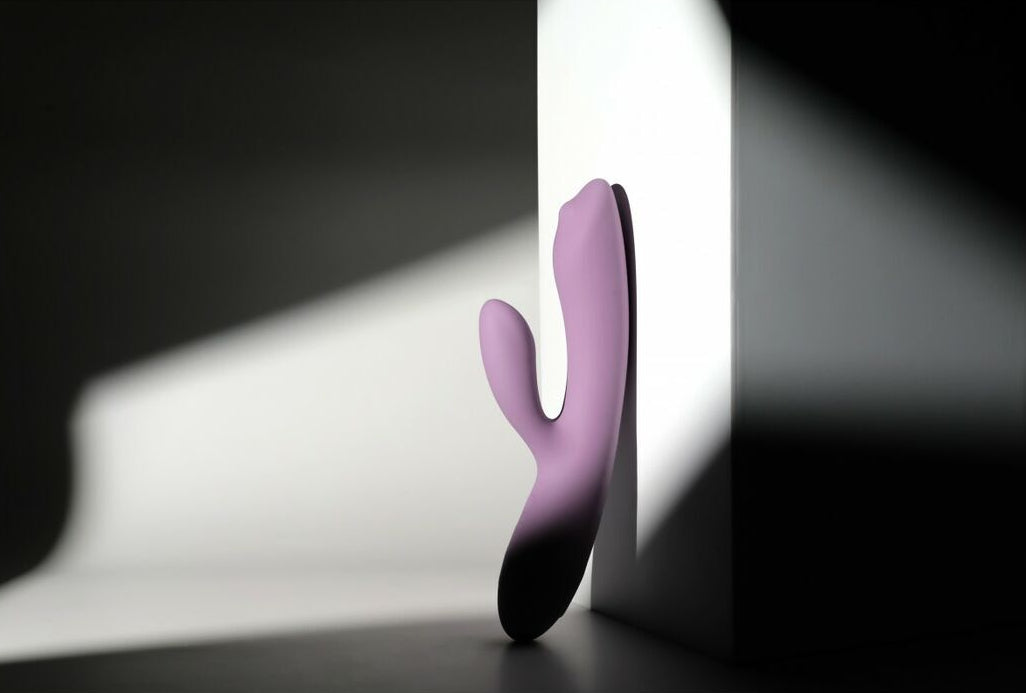 Purple rabbit massager on a black and white background