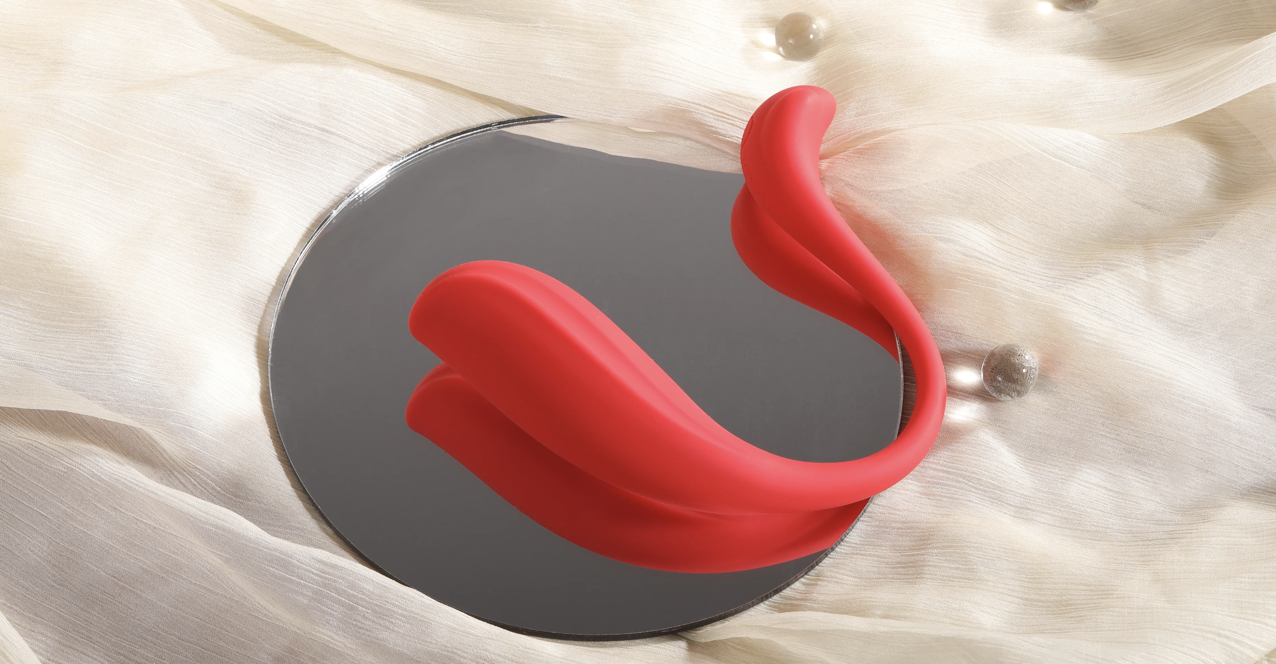 Red and silver device on a textured white surface