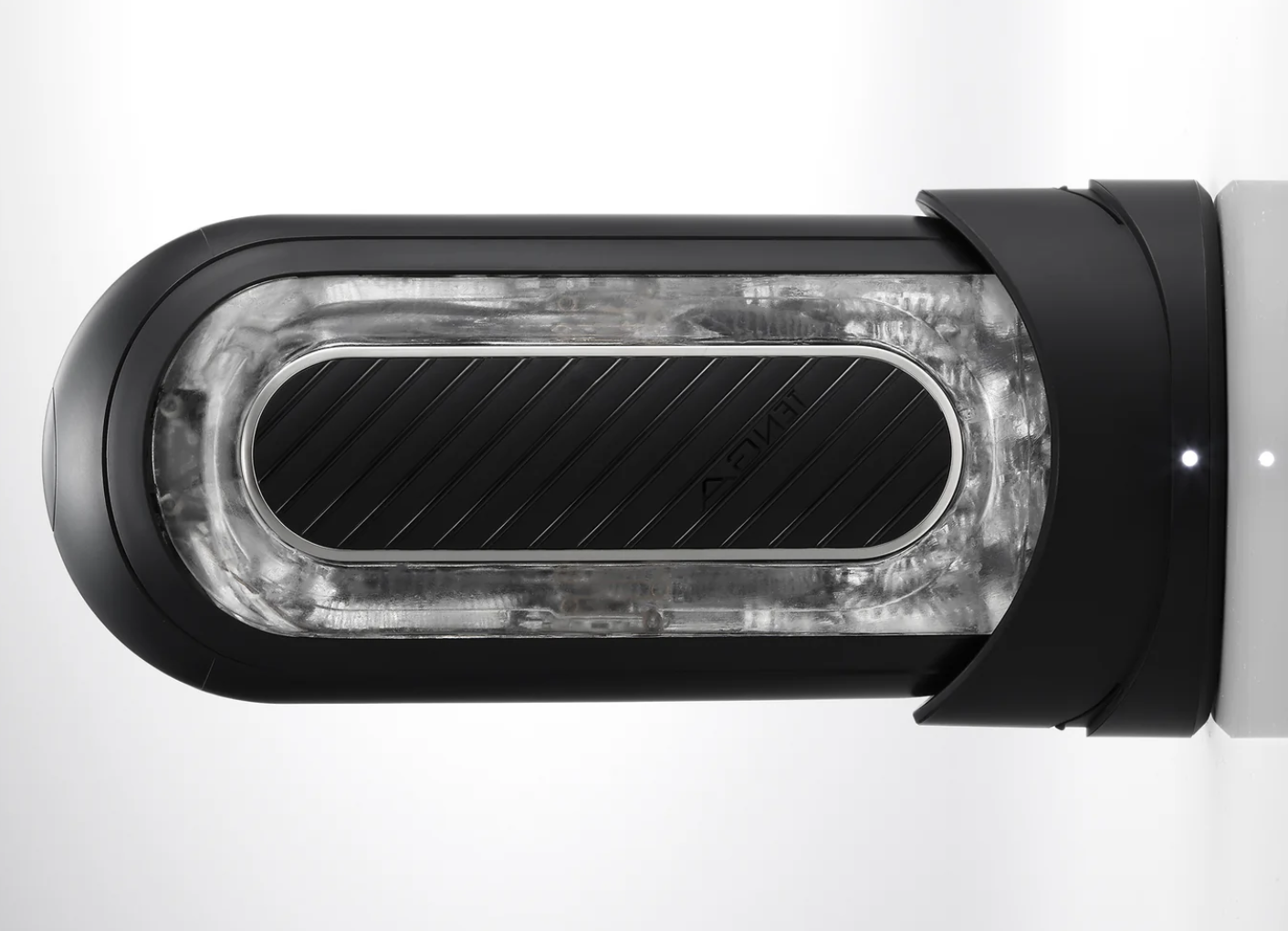 Black automatic masturbator device with transparent front panel on a white background