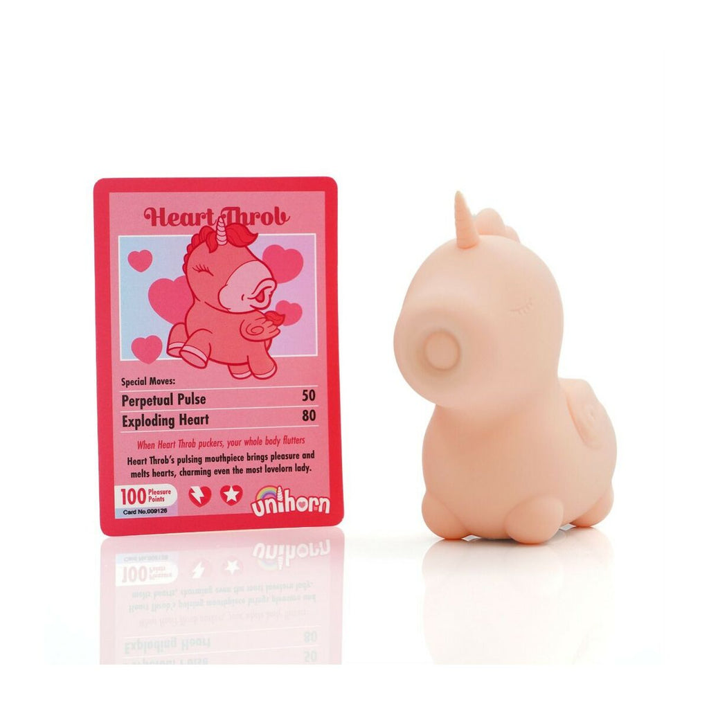Pink unicorn sexual wellness pleasure toy intended for adults only with a trading card on a white background