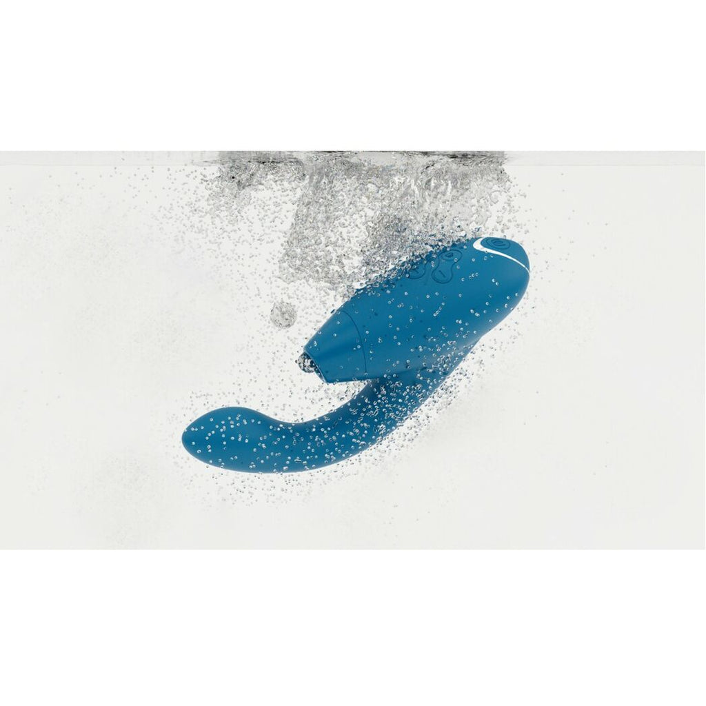 Blue adult erotic toy with white specks on a light gray background