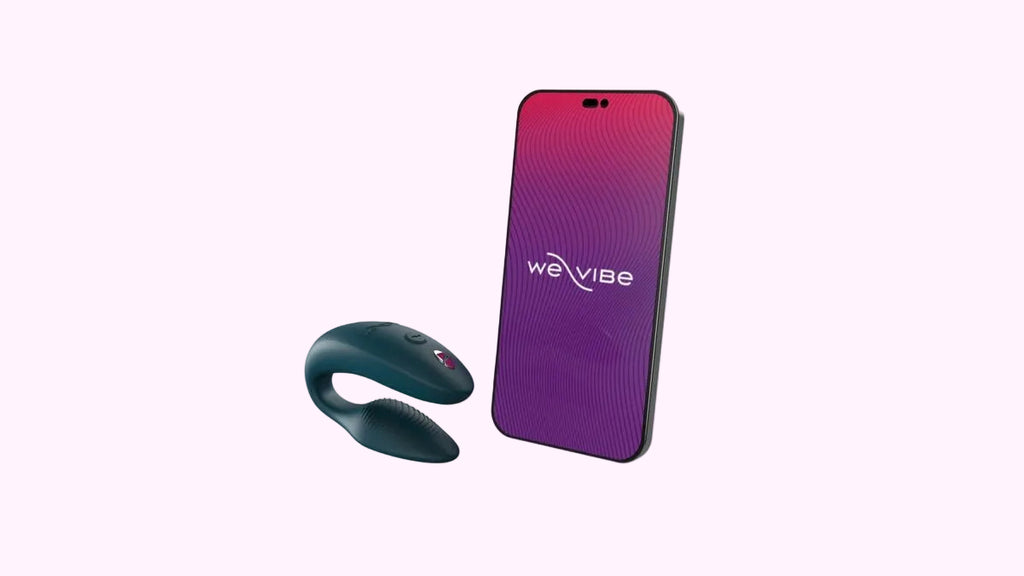 Phone with purple and pink gradient app 'wevibe' and black clitoral stimulator device on a white background