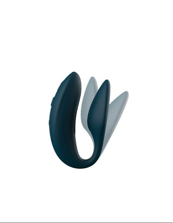 dark blue vibrating erotic toy on a white background