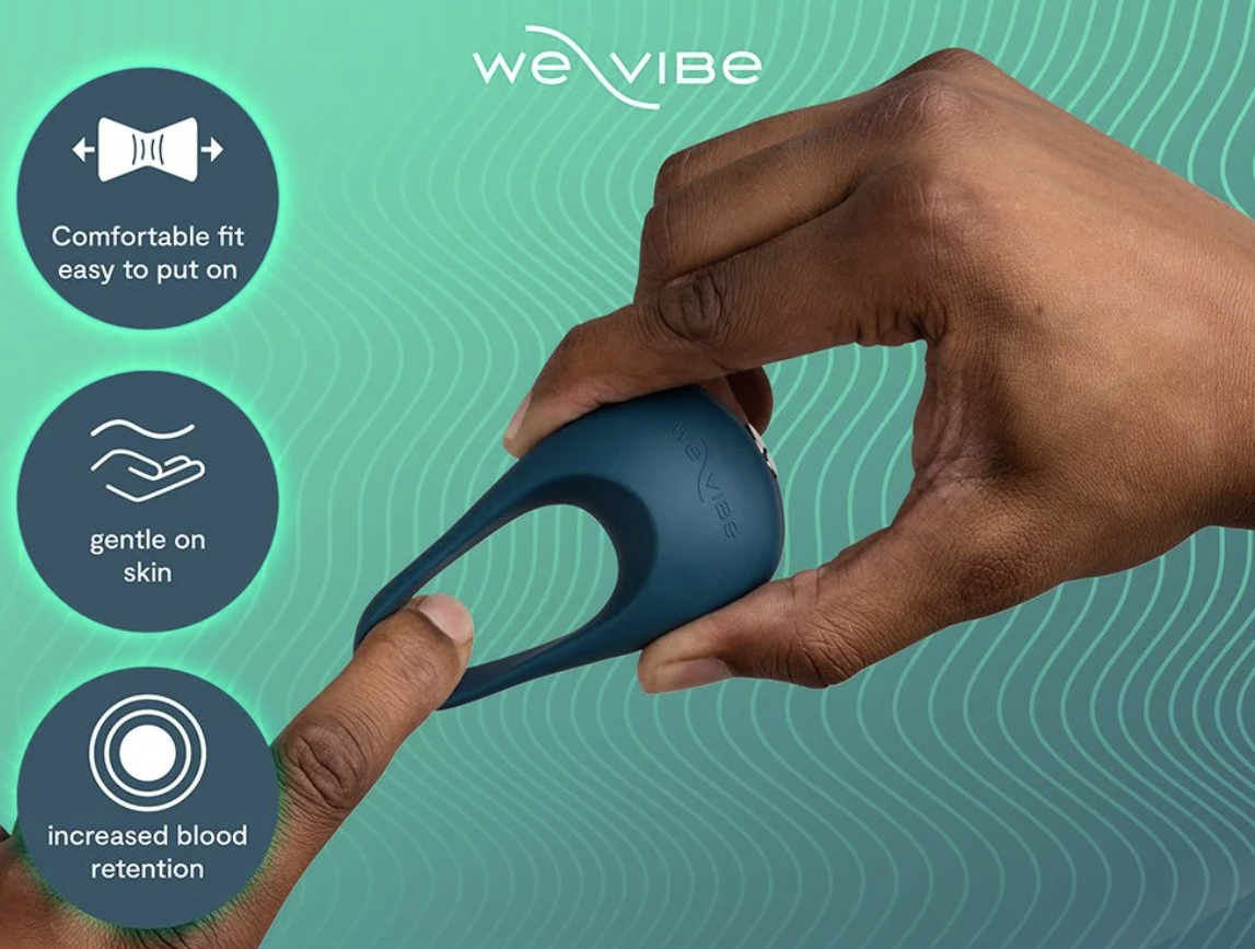 Hand holding a blue We-Vibe cock ring product with features listed on a teal background