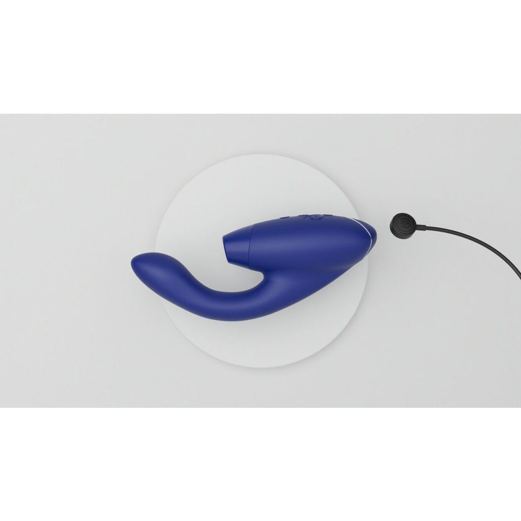 Blue adult pleasure toy with charging cable on a white background