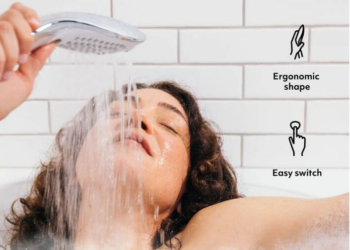 Person using a shower head with text about ergonomic design and switch ease.